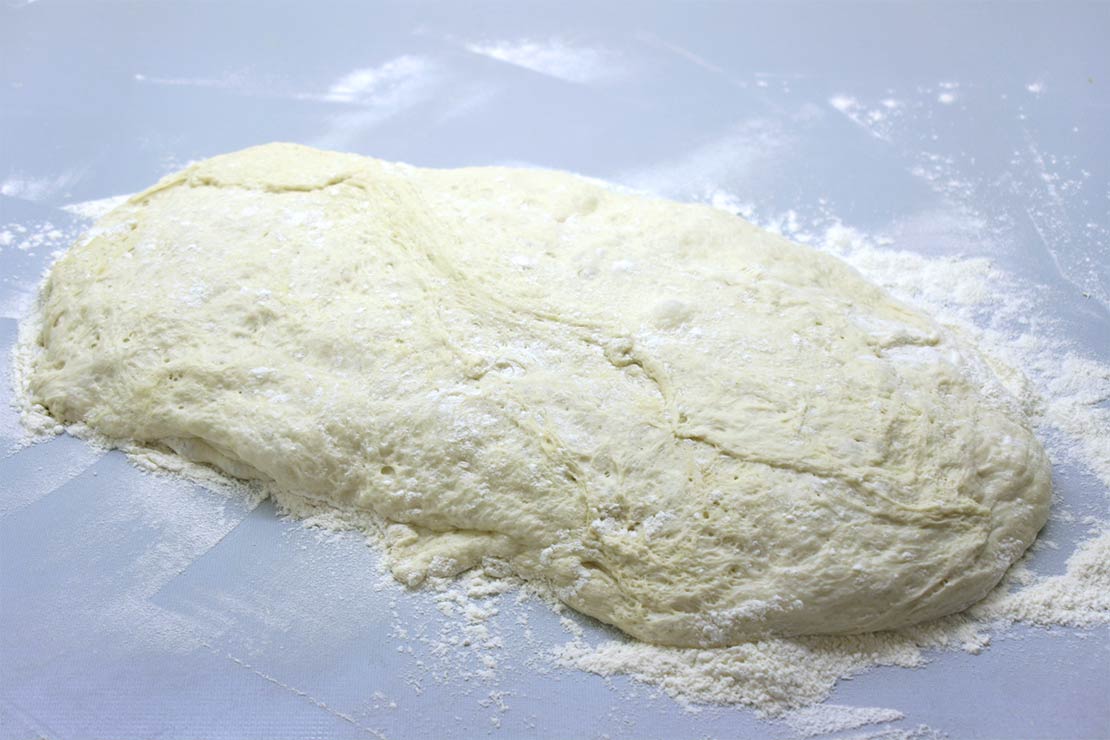 the dough tipped onto a floured work surface