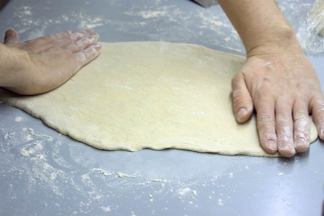 stretching the pizza dough