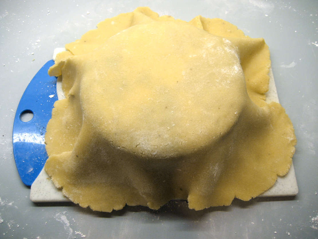 Draping the marzipan over the cake
