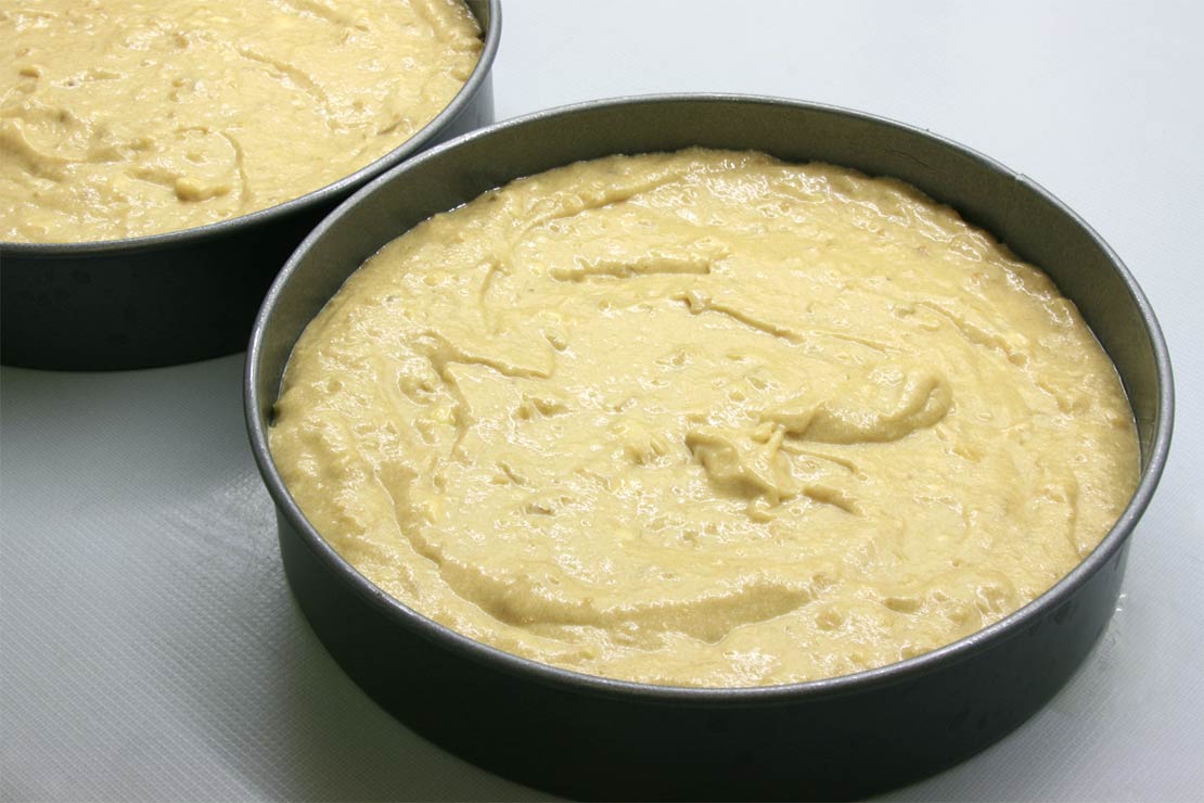 the cake batter in the tins