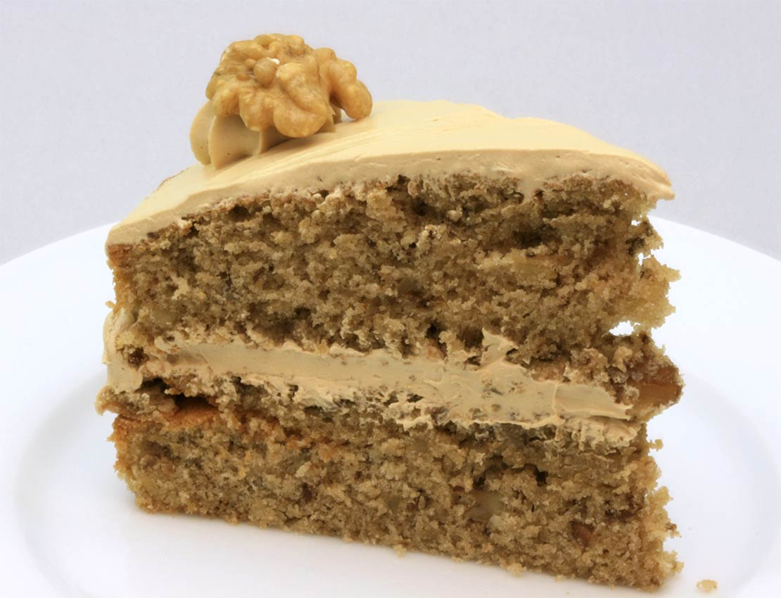 a slice of the finished coffee and walnut cake