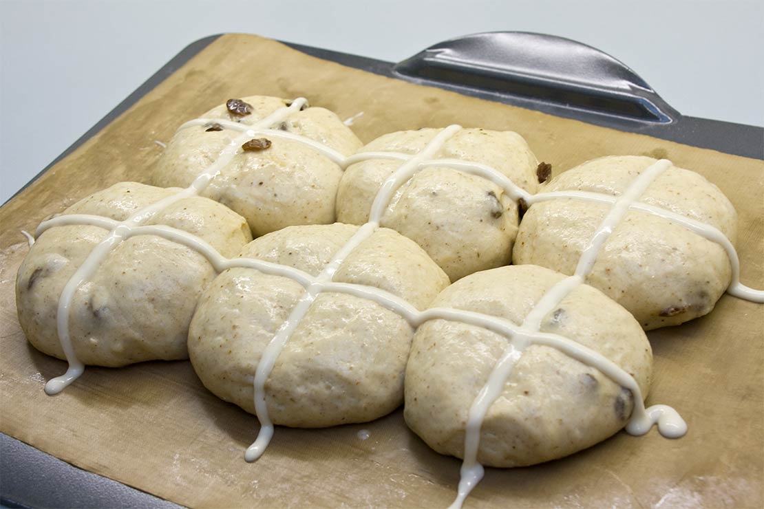 the hot cross buns ready for the oven