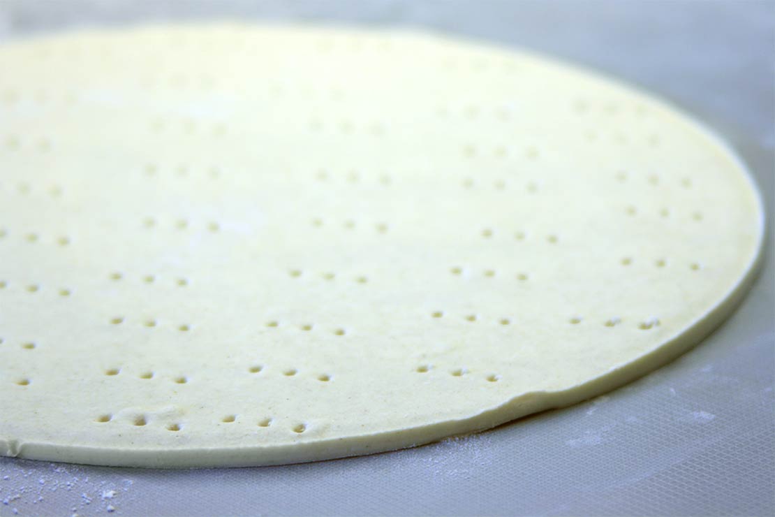 the rolled out and pricked pastry