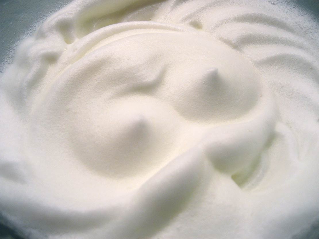whisking the egg whites to the soft-peak stage
