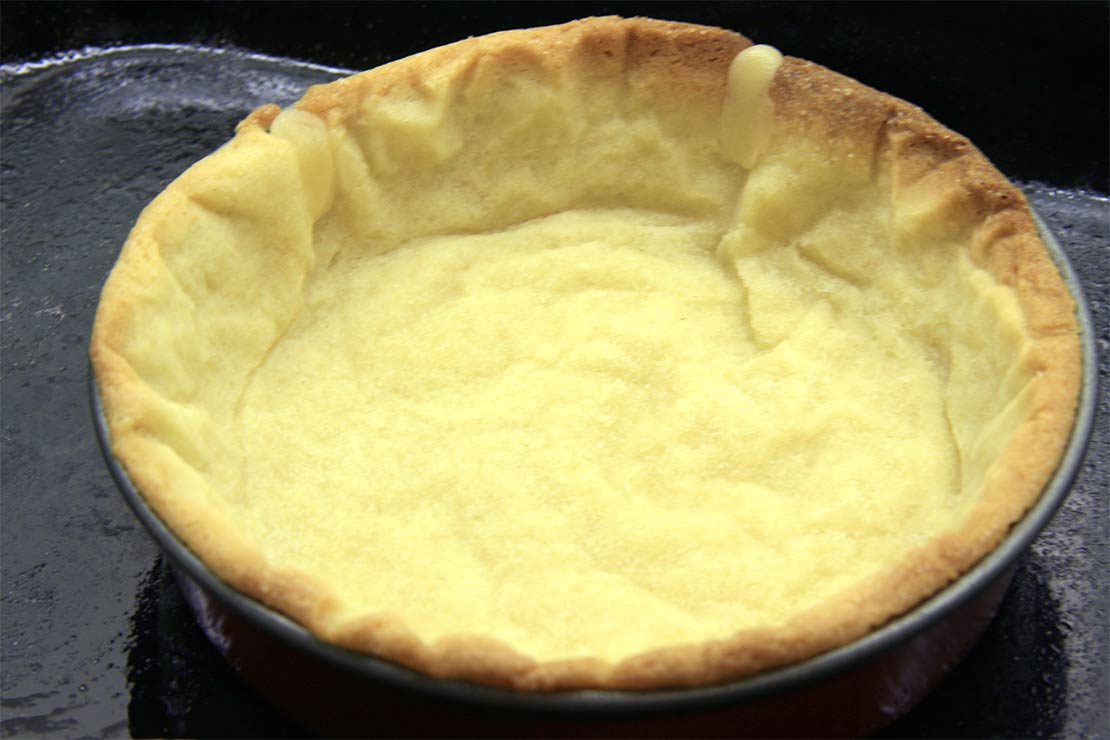 the partially cooked, patched pastry cases