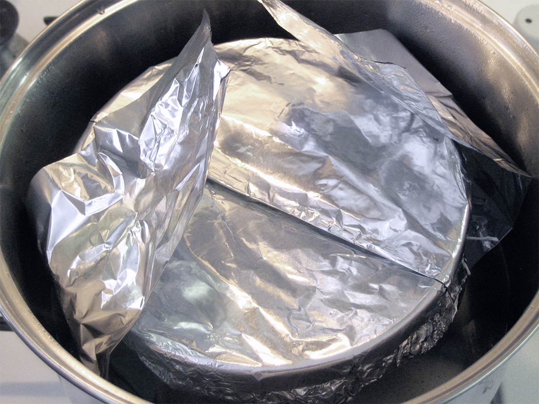 putting the pudding into the pan