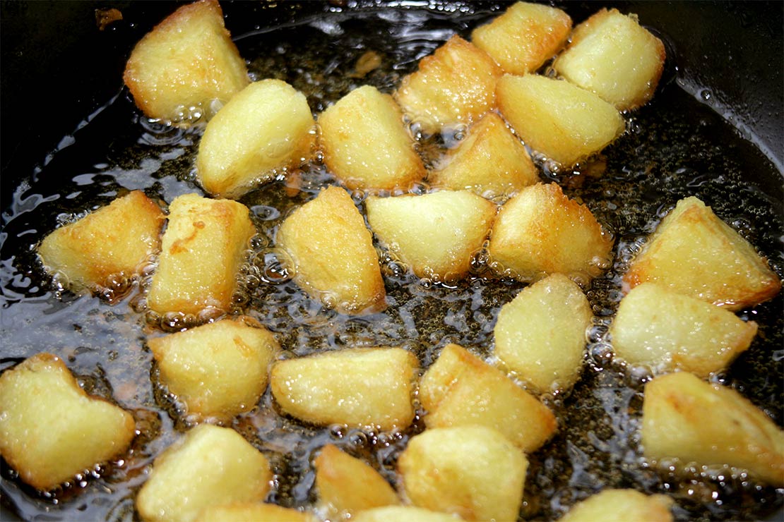 the potatoes frying in the pan