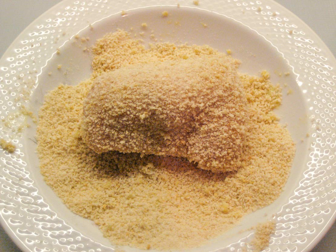 Coating the Kiev in breadcrumbs