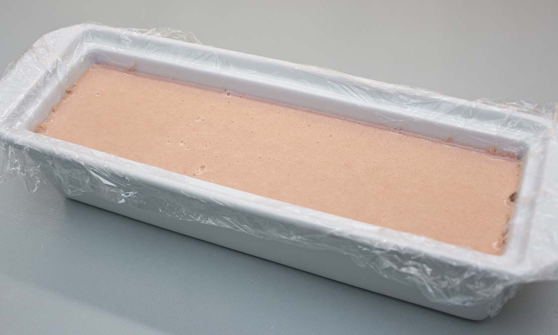 pouring the mixture into the terrine