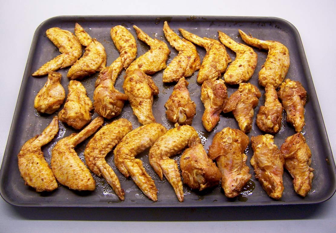 the wings on a baking tray