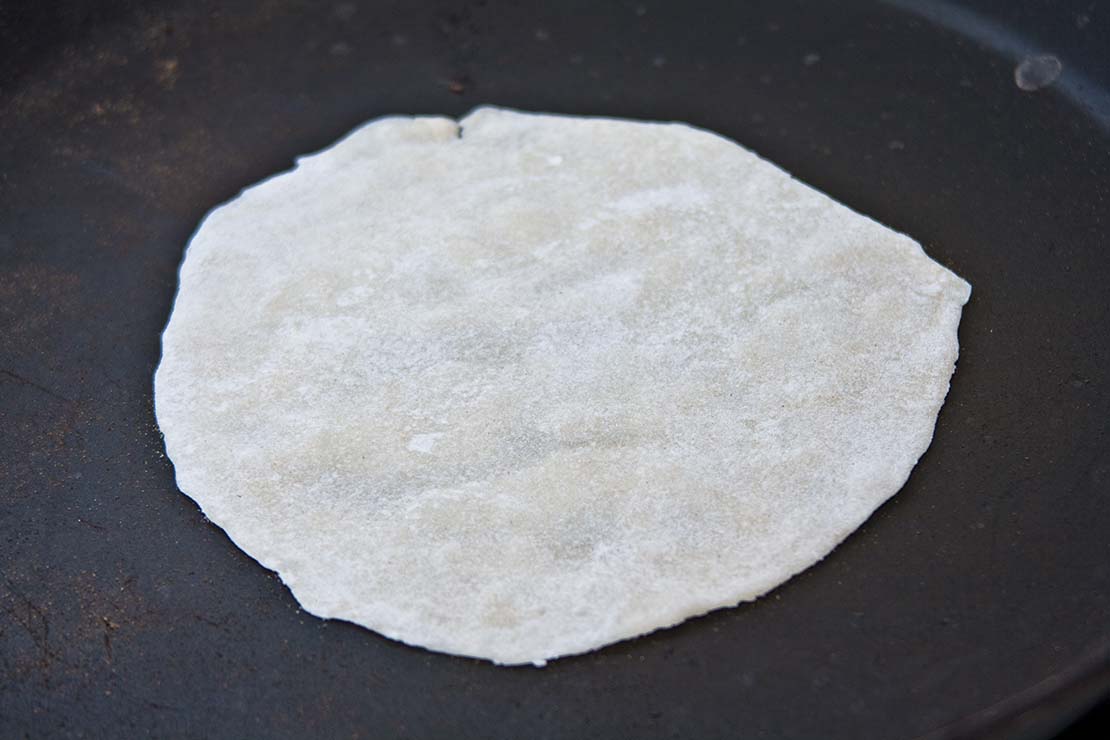 dry frying the first side of the pancake
