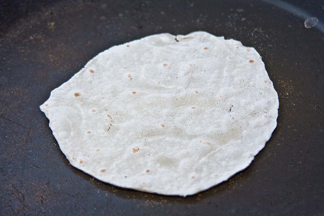 dry frying the second side of the chinese pancake