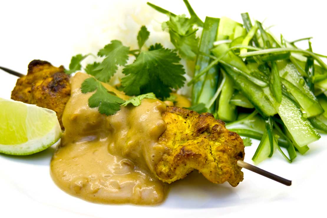 the finished chicken satay sticks and sauce