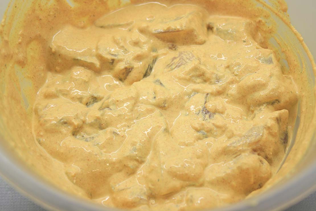 the chicken pieces coated in marinade