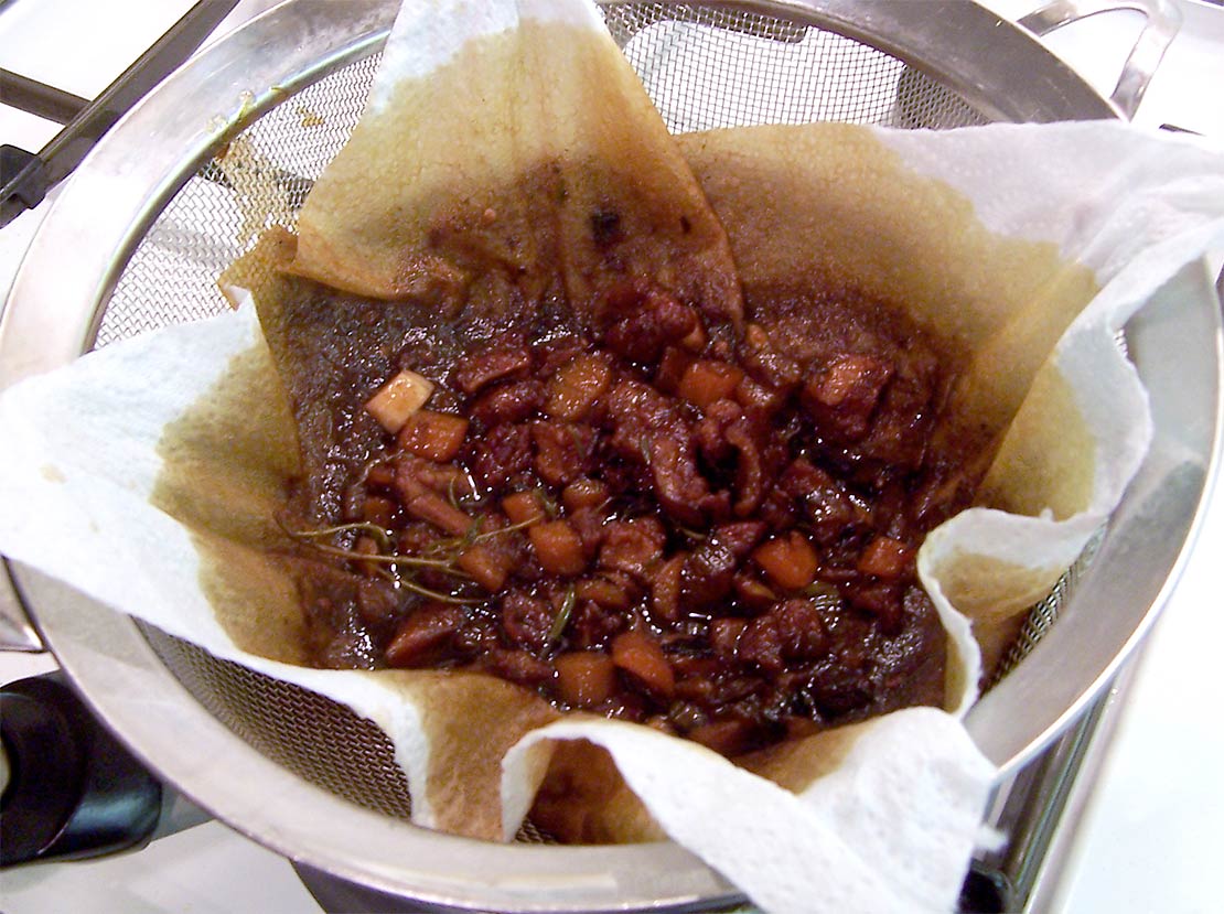 straining through a sieve