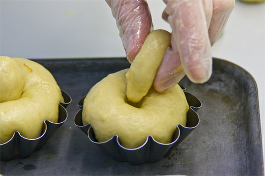 inserting the plug into the top of each bun