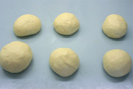 the divided dough, shaped into balls