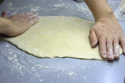 stretching the pizza dough