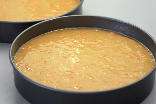 the carrot cake batter in two cake tins