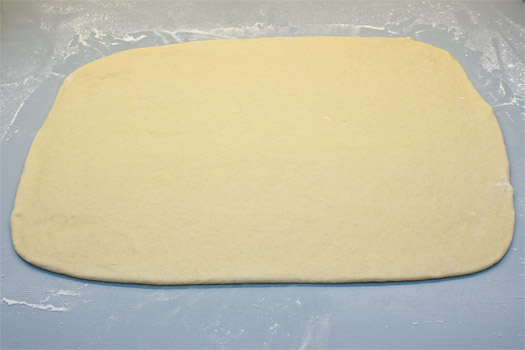 the dough rolled out on the worktop