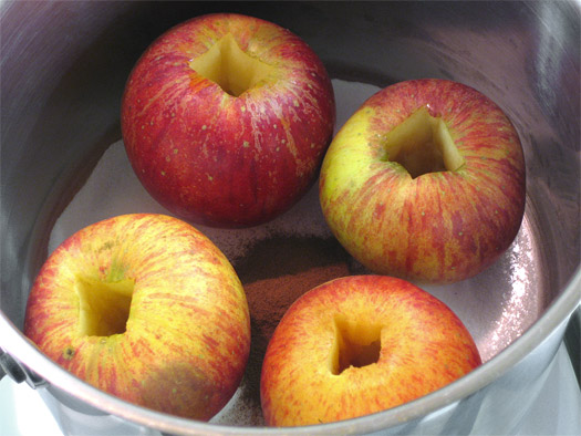 the apple poaching ingredients in a pan