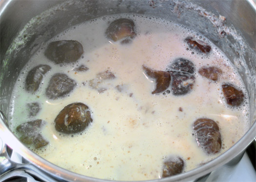 the cooked chestnuts and milk in a pan