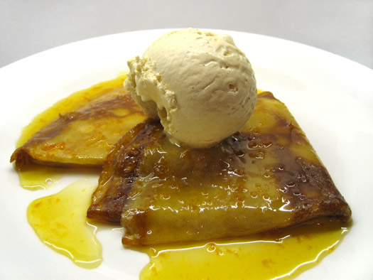 the finished crêpe suzette with a ball of icecream