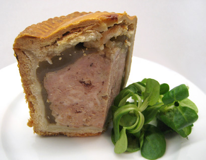 a slice of the finished pork pie