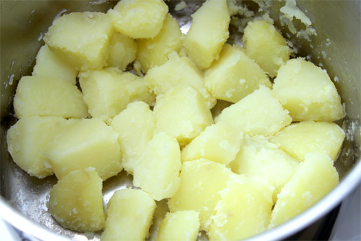 the boiled, roughened potatoes