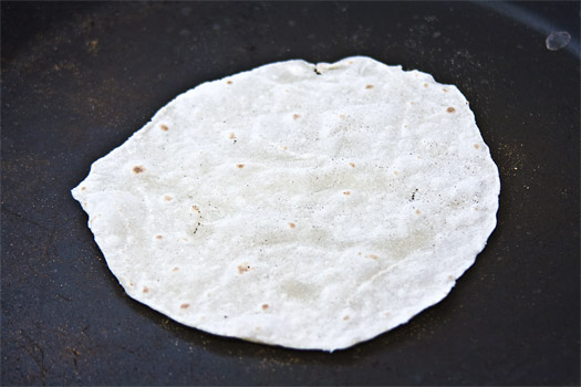 dry frying the second side of the chinese pancake