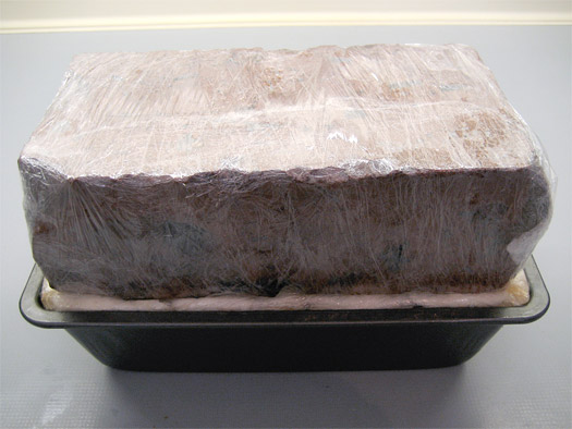 the terrine with a brick on it
